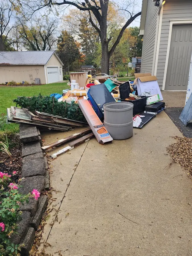 Dumpster being loaded with debris for 30 Yard Dumpster Rental in Kennesaw
